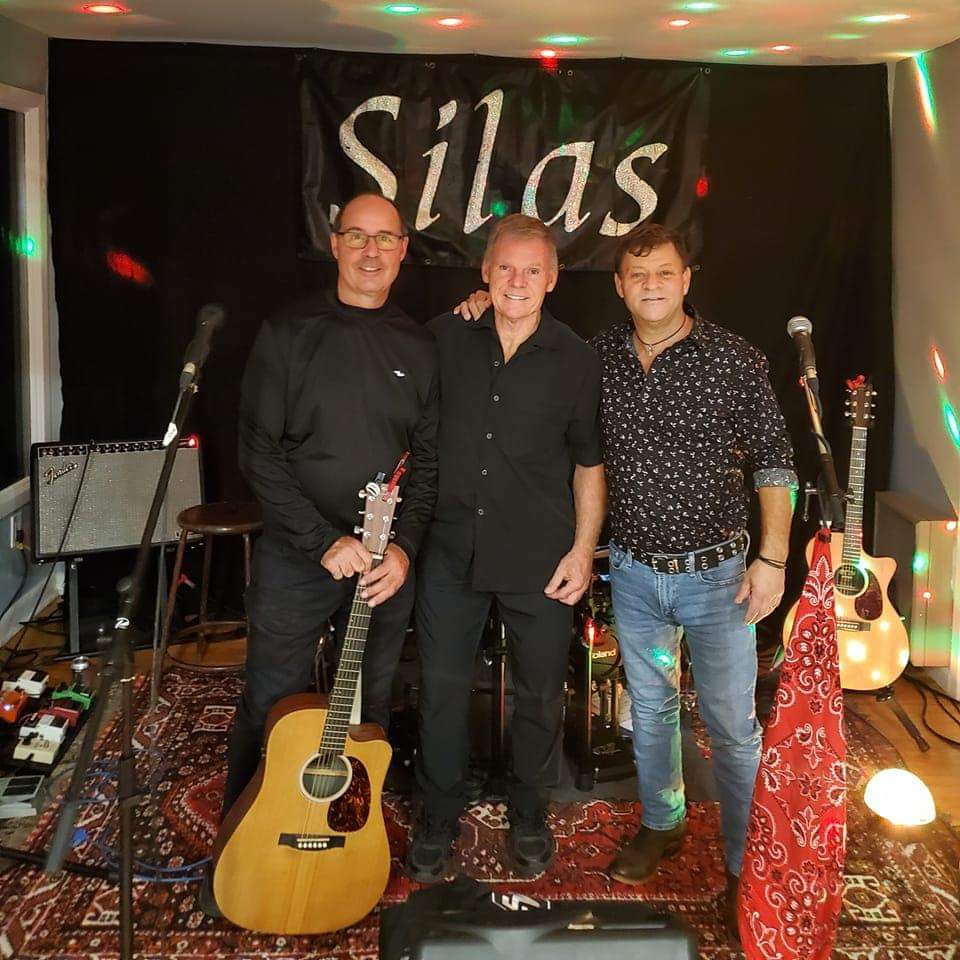 Three members of SILAS posing for a photo